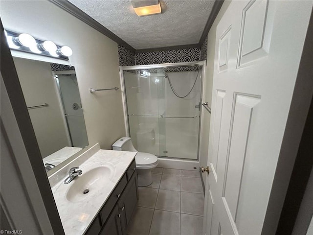 267 S Boyles St, Pilot Mountain, NC 27041 - bathroom featuring a stall shower, a textured ceiling, vanity, toilet, and tile patterned flooring