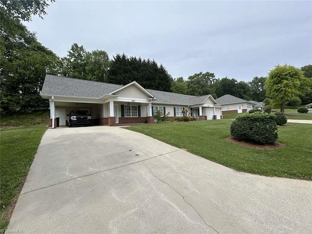 267 S Boyles St, Pilot Mountain, NC 27041 - single story home featuring driveway, a front yard, brick siding, a porch, and an attached carport