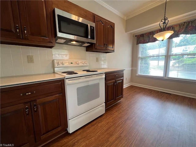 kitchen with stainless steel microwave, white electric stove, crown molding, light countertops, and dark wood-style floors