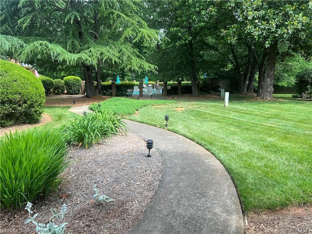 surrounding community featuring a lawn