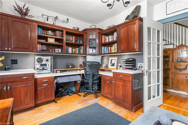 office featuring light wood finished floors and built in study area