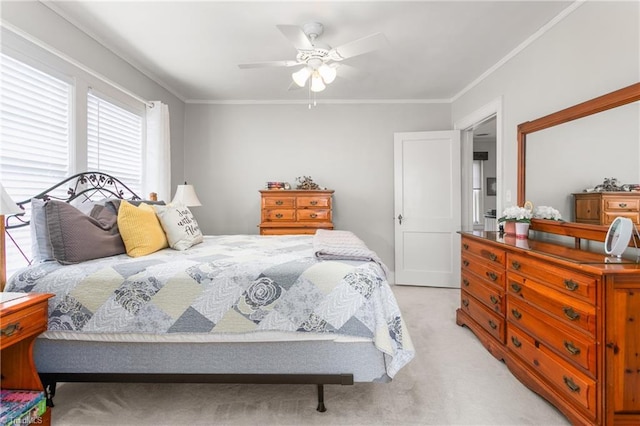 bedroom featuring light carpet, ceiling fan, and ornamental molding