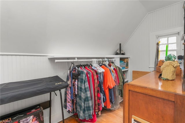 spacious closet featuring vaulted ceiling and wood finished floors