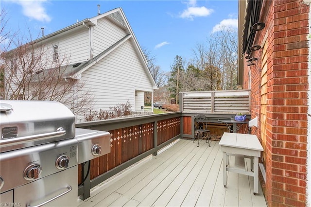 wooden terrace with area for grilling