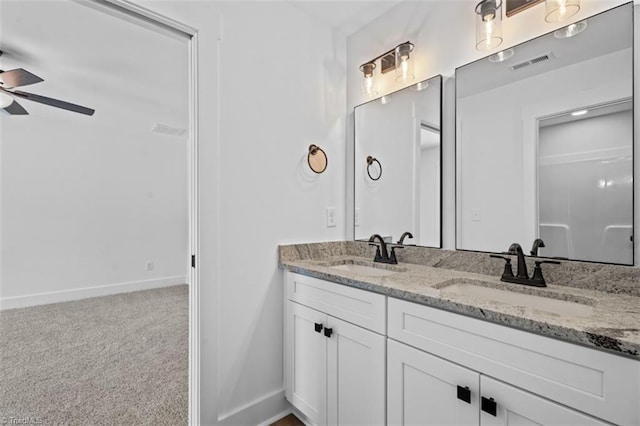 bathroom featuring vanity and ceiling fan