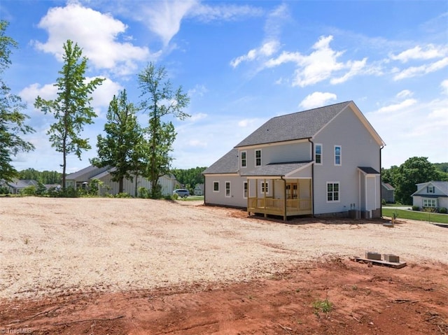 rear view of house with a wooden deck