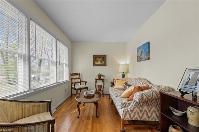 living room with light wood finished floors and baseboards