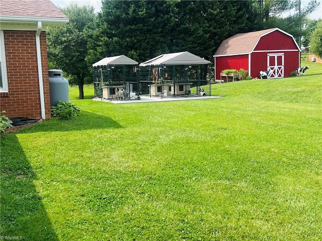 216 E Devon Dr, Mount Airy, NC 27030 - view of grassy yard with an outbuilding, a patio, and a barn