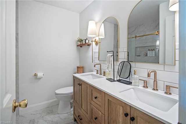 216 E Devon Dr, Mount Airy, NC 27030 - bathroom featuring marble finish flooring, double vanity, a stall shower, and backsplash