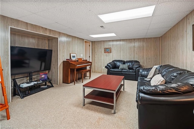 216 E Devon Dr, Mount Airy, NC 27030 - carpeted living room featuring wood walls and a paneled ceiling