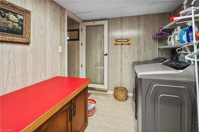 216 E Devon Dr, Mount Airy, NC 27030 - washroom featuring washing machine and clothes dryer, cabinet space, and wooden walls