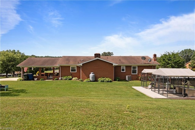 216 E Devon Dr, Mount Airy, NC 27030 - rear view of house with a patio area, a gazebo, a yard, and a chimney
