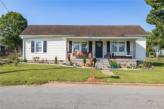 view of front of home featuring covered porch and a front yard