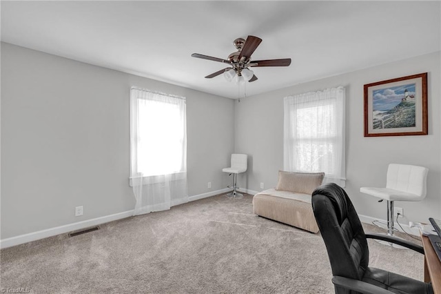 office area with carpet and ceiling fan