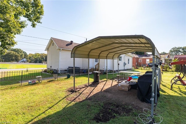 exterior space with a yard and a carport