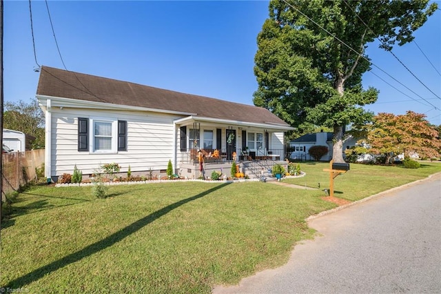 view of front facade with covered porch and a front yard