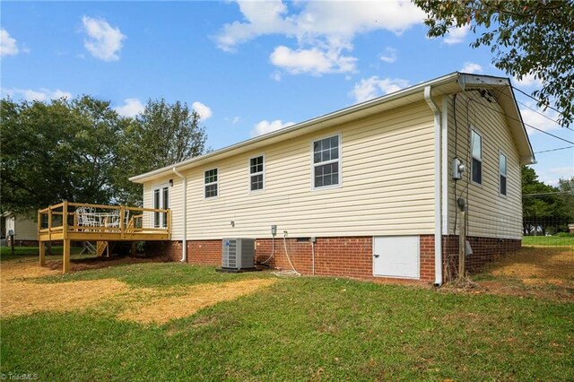 2505 Banner Whitehead Rd, Sophia, NC 27350 - back of property with a lawn, a deck, crawl space, and central AC unit