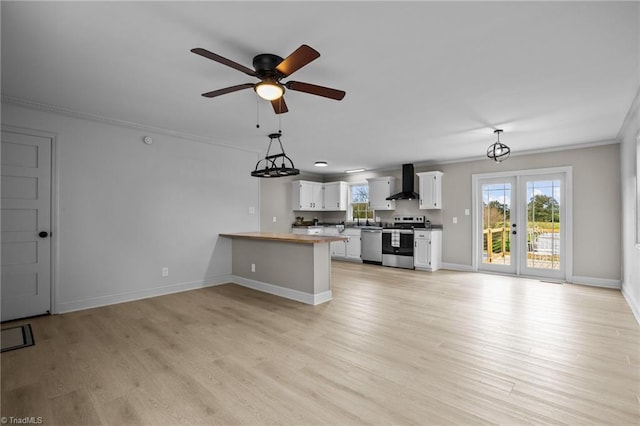 unfurnished living room with crown molding, light hardwood / wood-style flooring, and ceiling fan