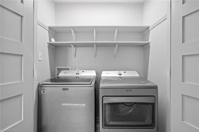 laundry room featuring independent washer and dryer