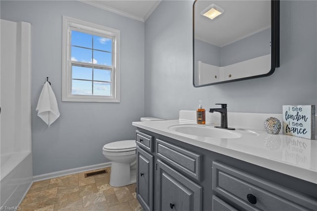 bathroom with vanity, toilet, crown molding, and a washtub