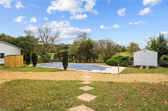 view of sport court with a lawn