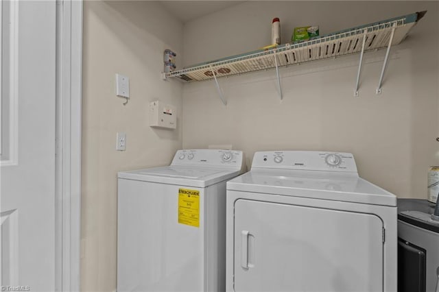 washroom with separate washer and dryer