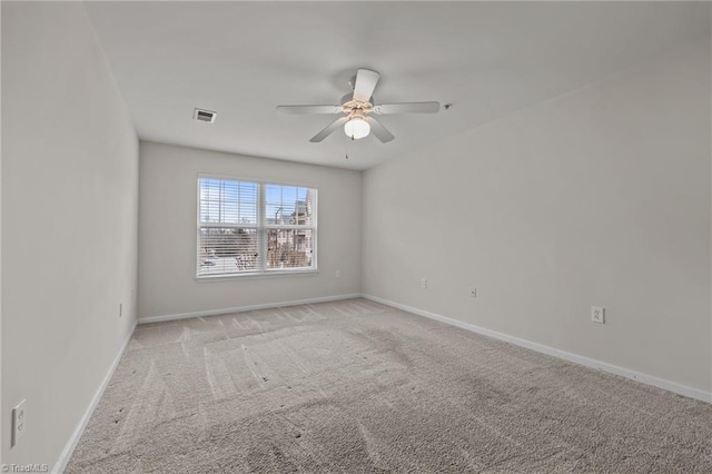 carpeted empty room with ceiling fan