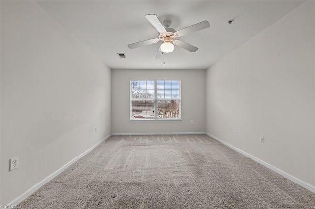 unfurnished room with light carpet and ceiling fan