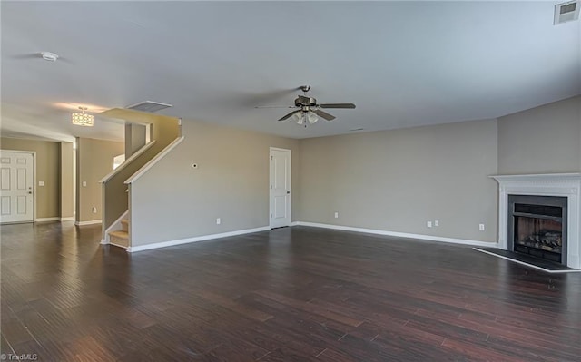 unfurnished living room with ceiling fan and dark hardwood / wood-style floors