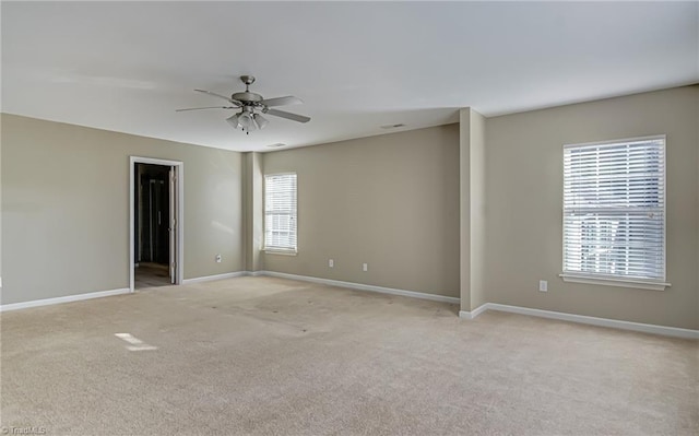 empty room with light carpet and ceiling fan