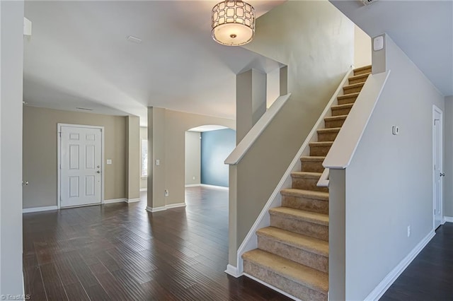 foyer entrance with dark wood-type flooring