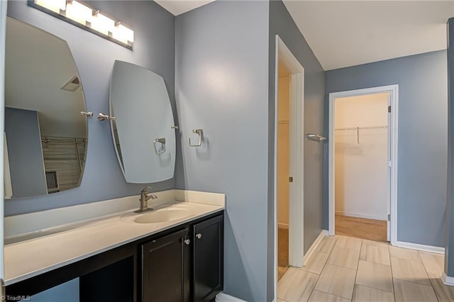 bathroom featuring tile patterned flooring and vanity