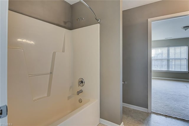 bathroom featuring shower / bathing tub combination and tile patterned floors