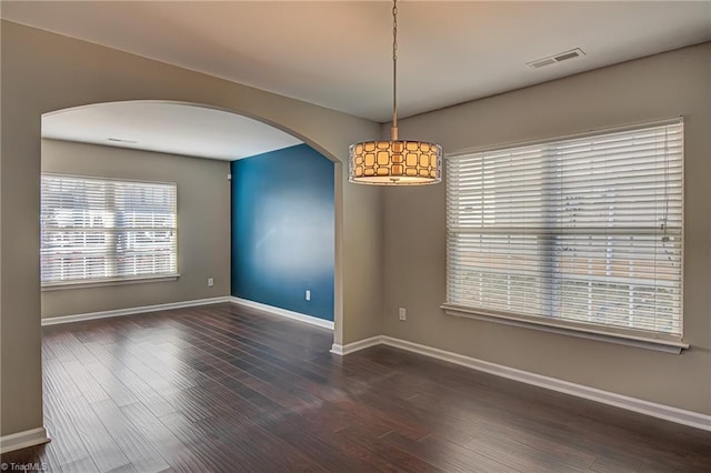 spare room featuring dark hardwood / wood-style floors