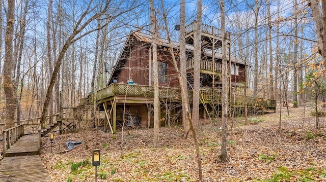 back of property with a wooden deck