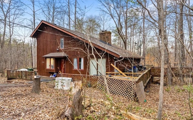 view of outbuilding featuring fence