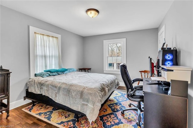 bedroom featuring dark hardwood / wood-style flooring