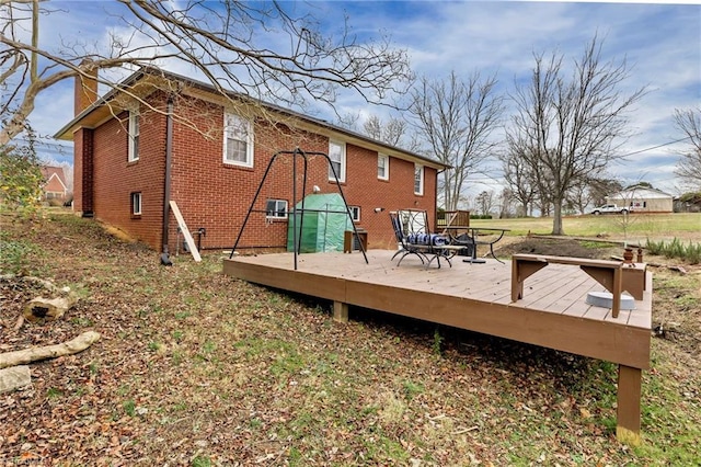 back of house featuring a deck