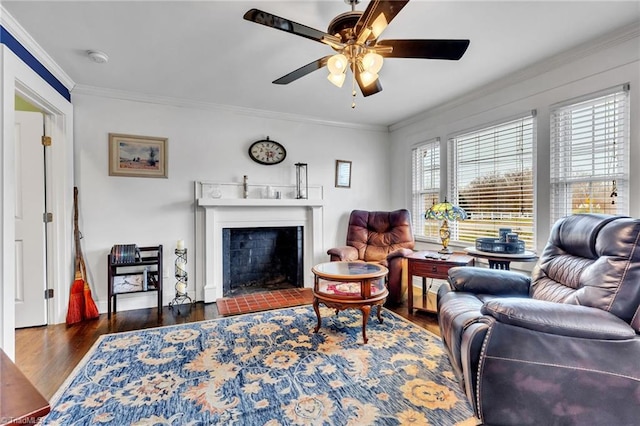 living room featuring dark hardwood / wood-style flooring, ornamental molding, and ceiling fan