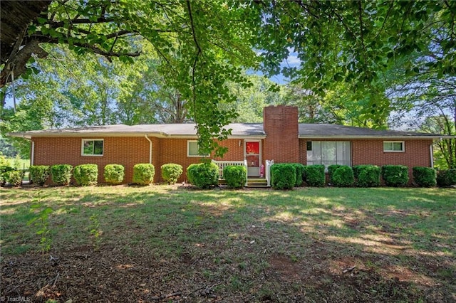 ranch-style house with a front yard