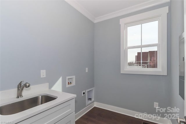 washroom featuring ornamental molding, a sink, cabinet space, electric dryer hookup, and washer hookup