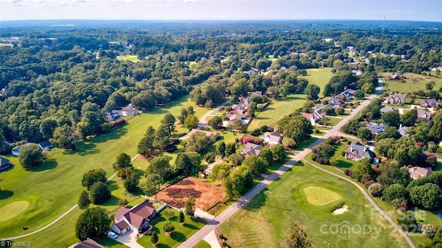 aerial view featuring view of golf course and a residential view