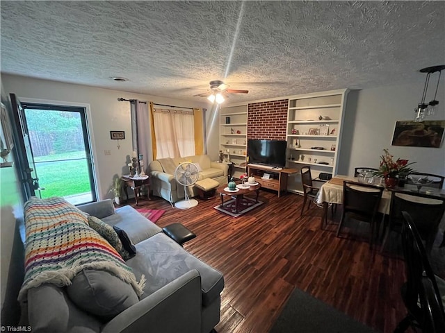 living room featuring a textured ceiling, ceiling fan, and wood-type flooring