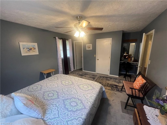 carpeted bedroom with a textured ceiling and ceiling fan