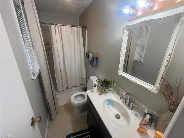 full bathroom featuring shower / bath combination with curtain, vanity, a textured ceiling, and toilet