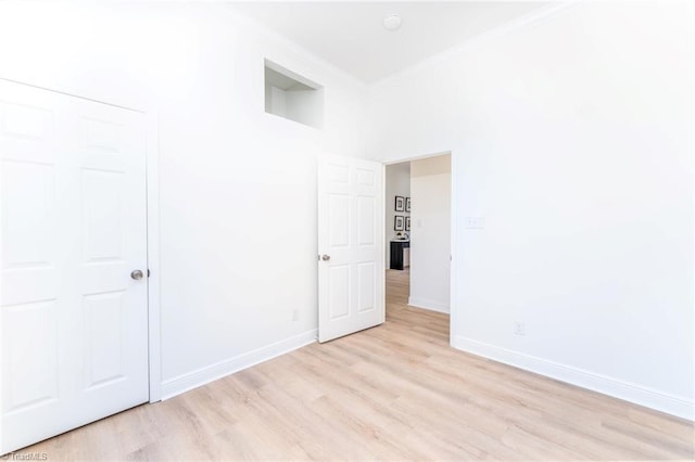 4114 Rose Lake Dr, Greensboro, NC 27407 - empty room featuring light hardwood / wood-style flooring and ornamental molding