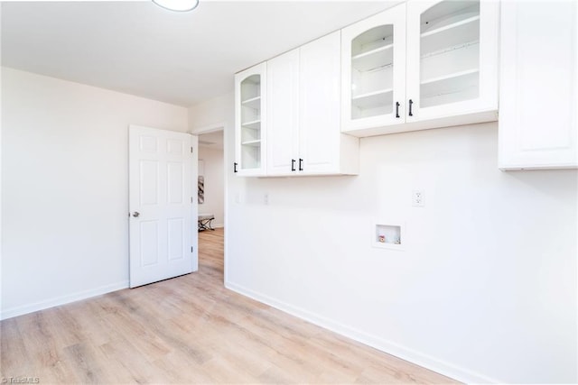 4114 Rose Lake Dr, Greensboro, NC 27407 - laundry area featuring light hardwood / wood-style floors, cabinets, and hookup for a washing machine