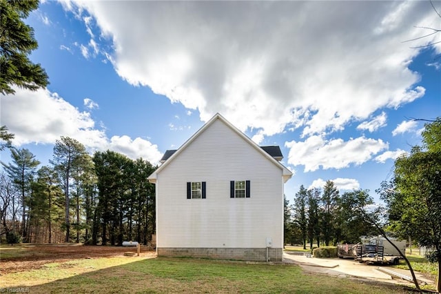 view of property exterior featuring a yard