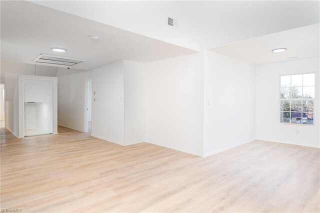 4114 Rose Lake Dr, Greensboro, NC 27407 - empty room featuring light wood-type flooring