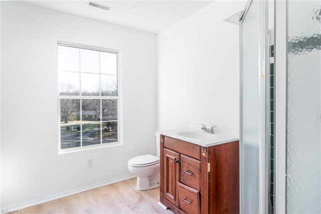 4114 Rose Lake Dr, Greensboro, NC 27407 - bathroom featuring wood-type flooring, vanity, and toilet